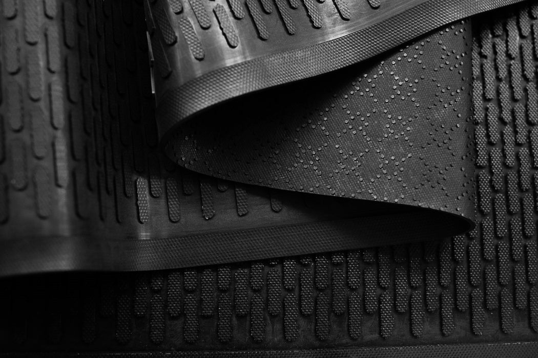 Close-up of black rubber mat and backing with textured surface