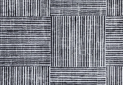 Patterned fabric with black and white stripes on a checkered background